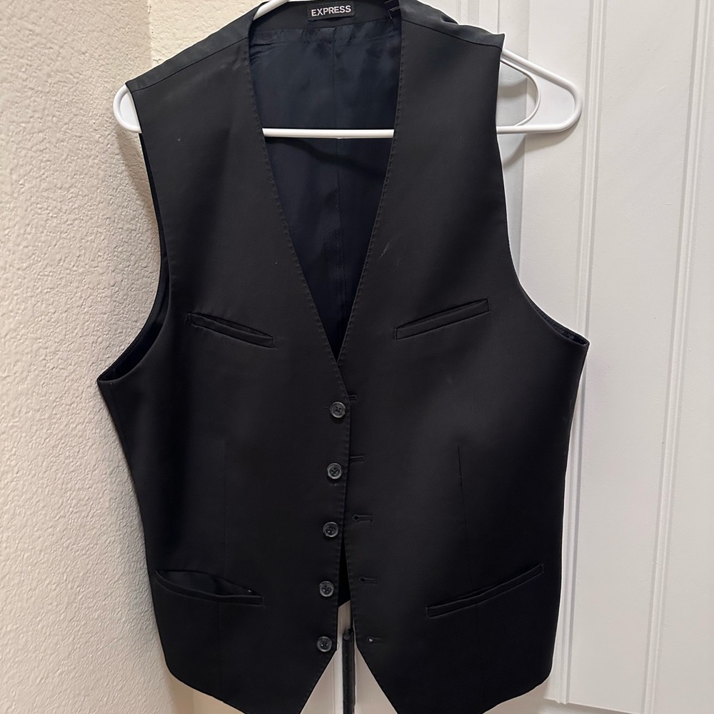 Three vests two are large and one is a medium